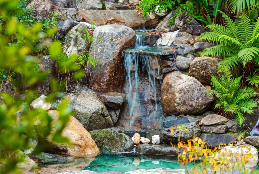 A peaceful waterfall within the lodge gardens